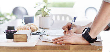 photo of couple shopping online - links to personal banking debit card page