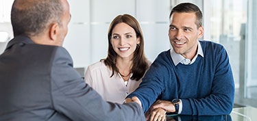photo of couple meeting banker - links to meet your expert lending team page