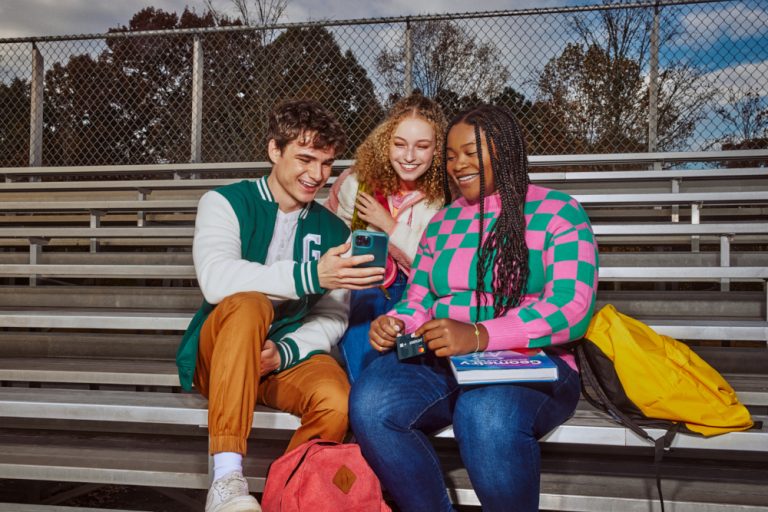 Kids looking at phone/greenlight